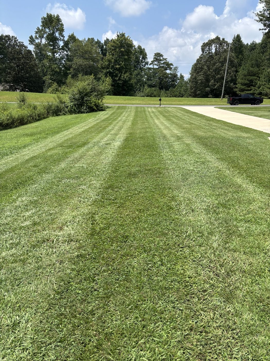 Long, even mowing stripes across a large lawn