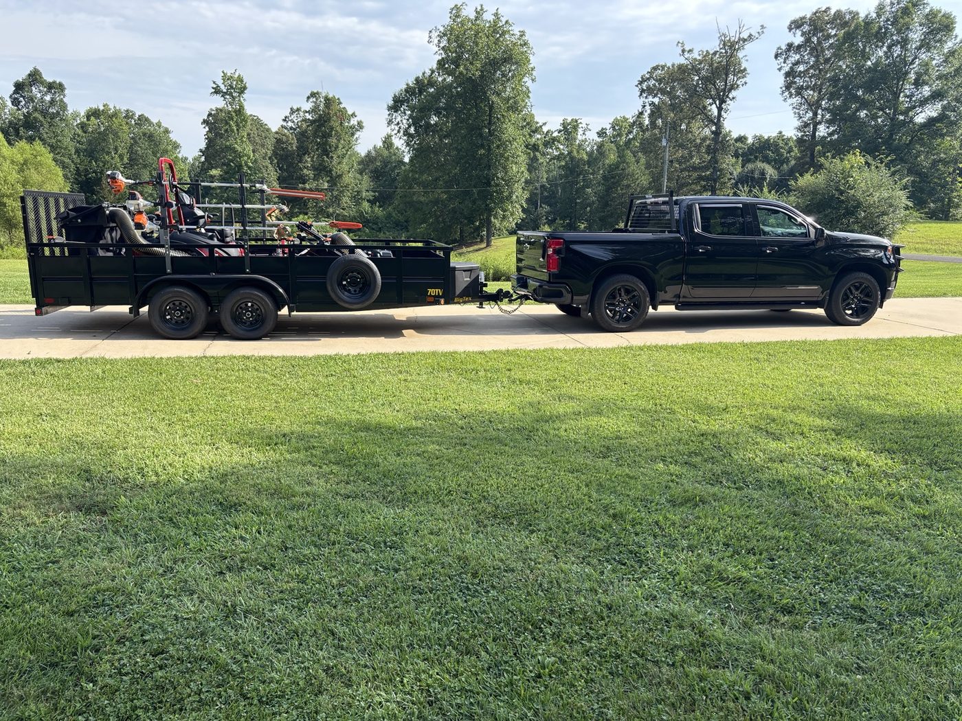 Premier's truck and trailer with commercial mowing equipment